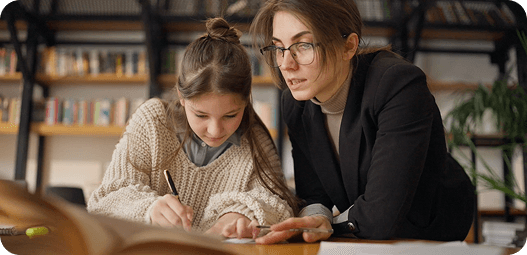 Two people studying together indoors.