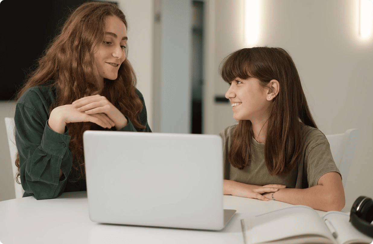 Two people engaged in learning together.